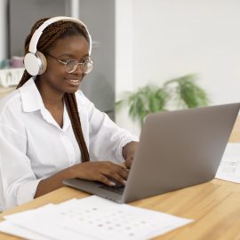 young-woman-working-with-her-headphones